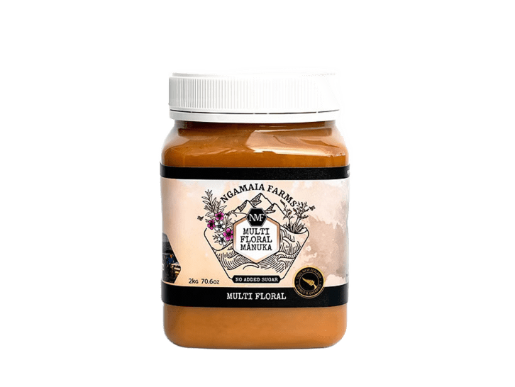 Beekeeper holding a honeycomb frame